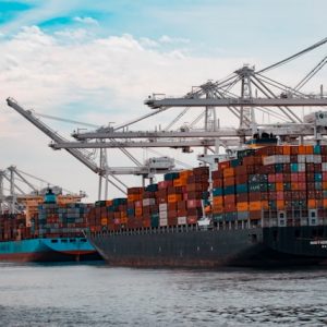 Cargo ships docked at a pier.