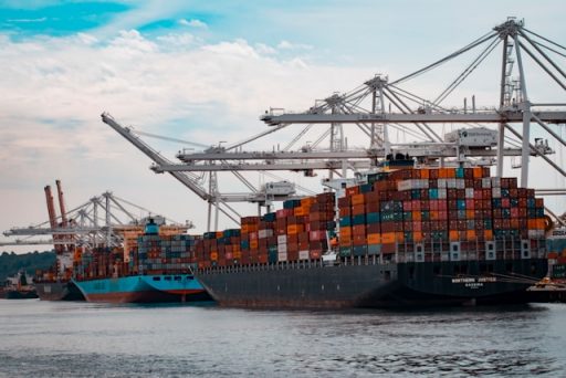 Cargo ships docked at a pier.