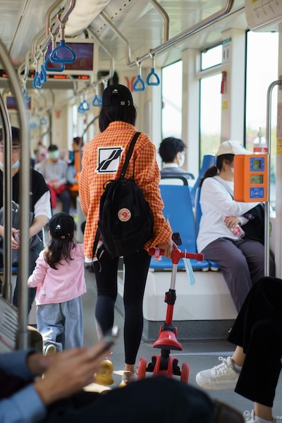 Mother and child boarding city bus