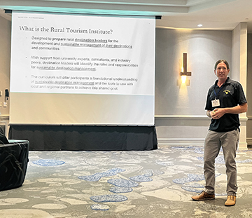 Doug Arbogast giving a presentation at conference. 
